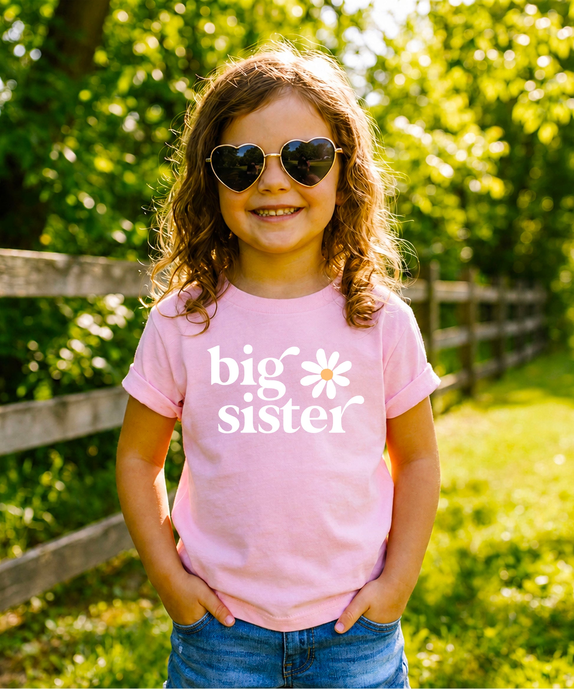 Big Sister Daisy sibling reveal tee for girls in Pink, styled view