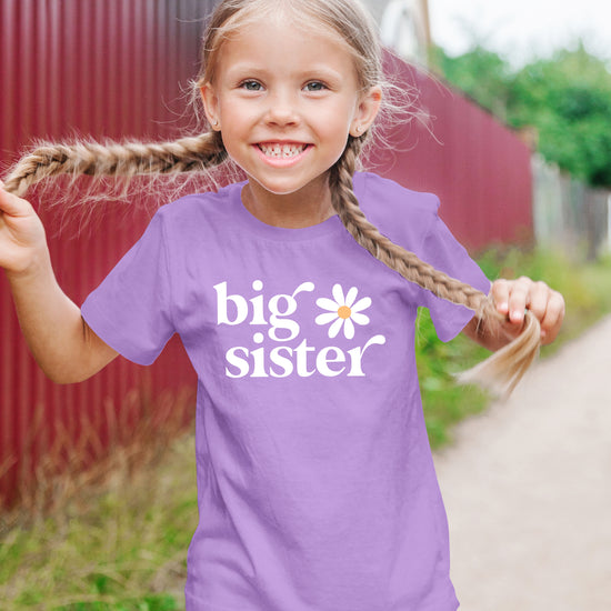 Big Sister Daisy sibling reveal tee for girls in Purple, lifestyle view