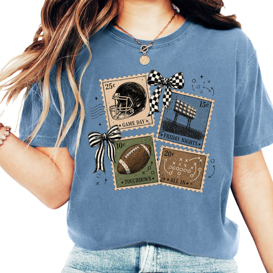 Vintage Football Stamps Coquette Bow Comfort Colors tee in Blue Jean - front view