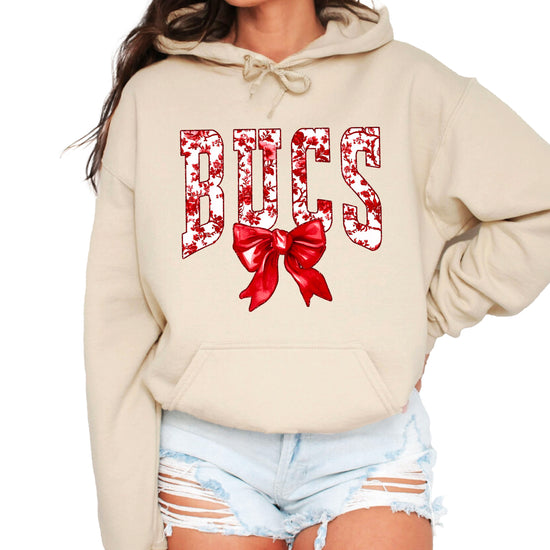 Sand hoodie front view with red floral BUCS varsity lettering and red bow