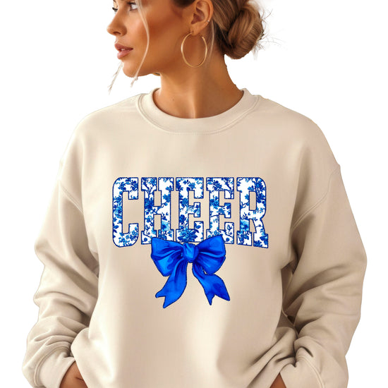 Sand cheer crewneck sweatshirt with blue floral CHEER lettering and coquette bow