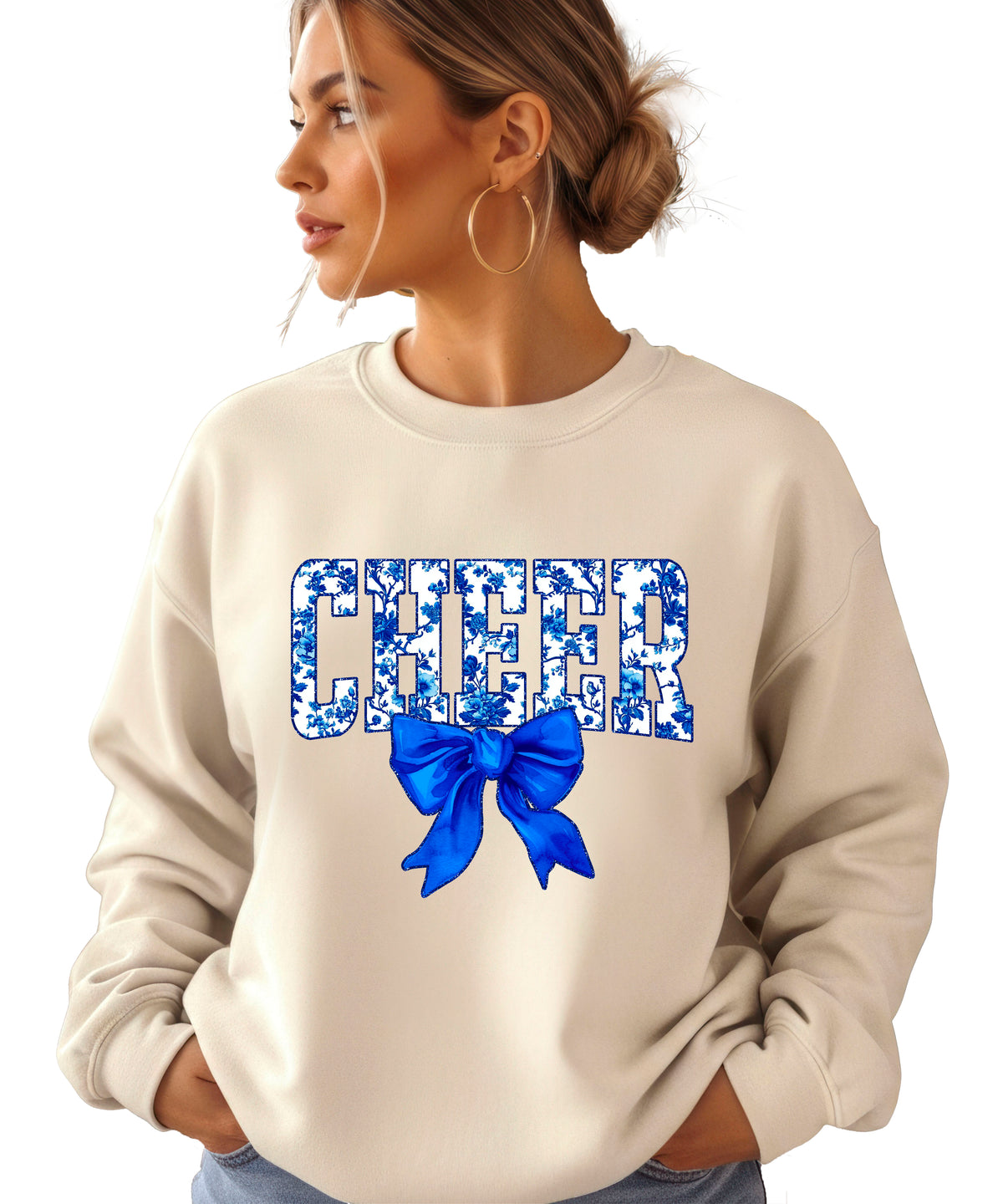 Sand cheer crewneck sweatshirt with blue floral CHEER lettering and coquette bow