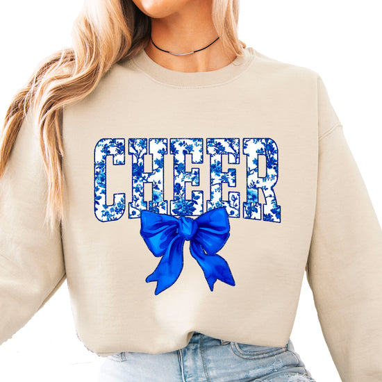 Sand cheer crewneck sweatshirt with blue floral CHEER lettering and coquette bow