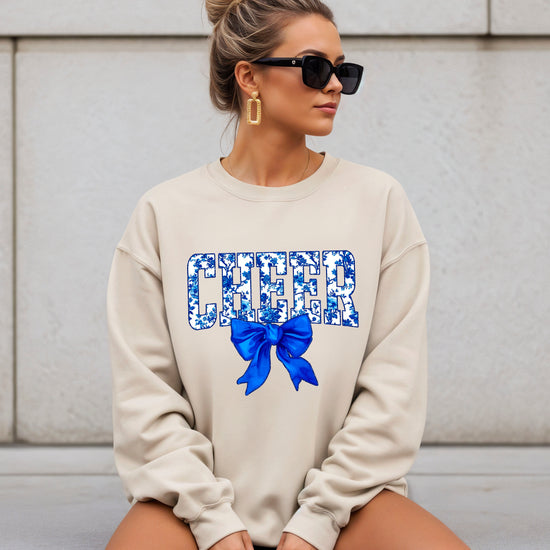 Sand cheer crewneck sweatshirt with blue floral CHEER lettering and coquette bow