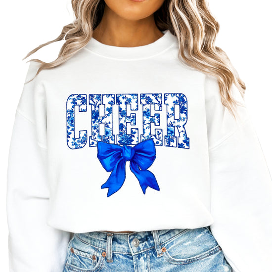 White cheer crewneck sweatshirt with blue floral CHEER lettering and coquette bow
