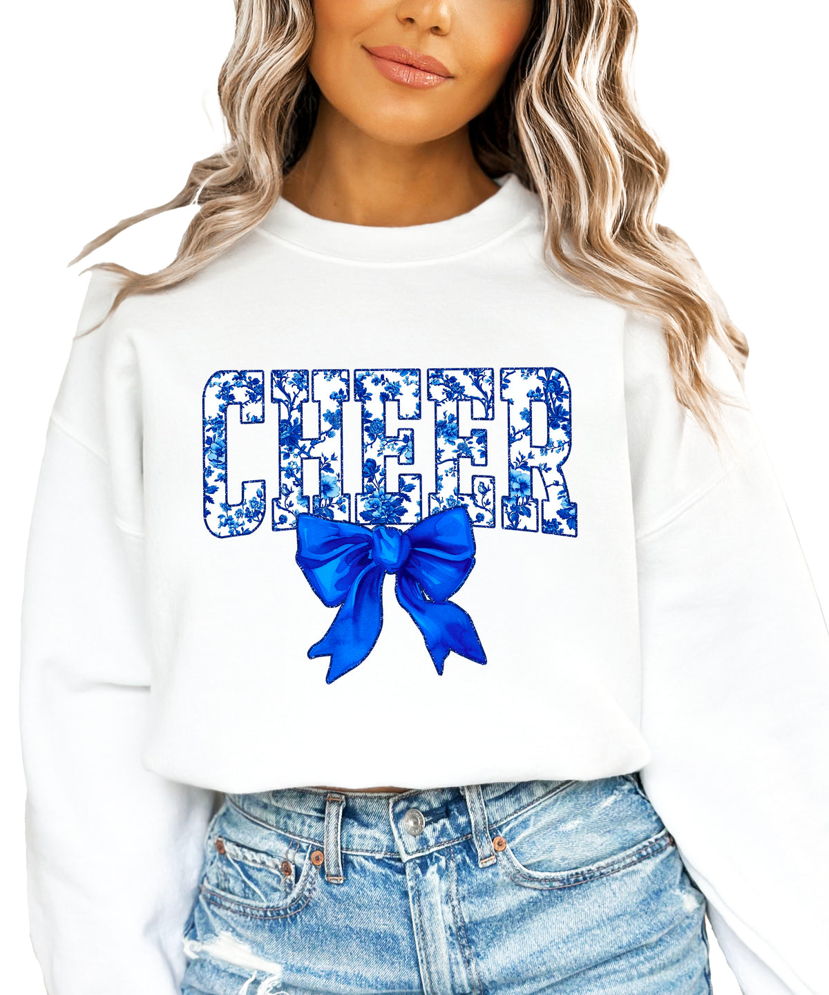 White cheer crewneck sweatshirt with blue floral CHEER lettering and coquette bow