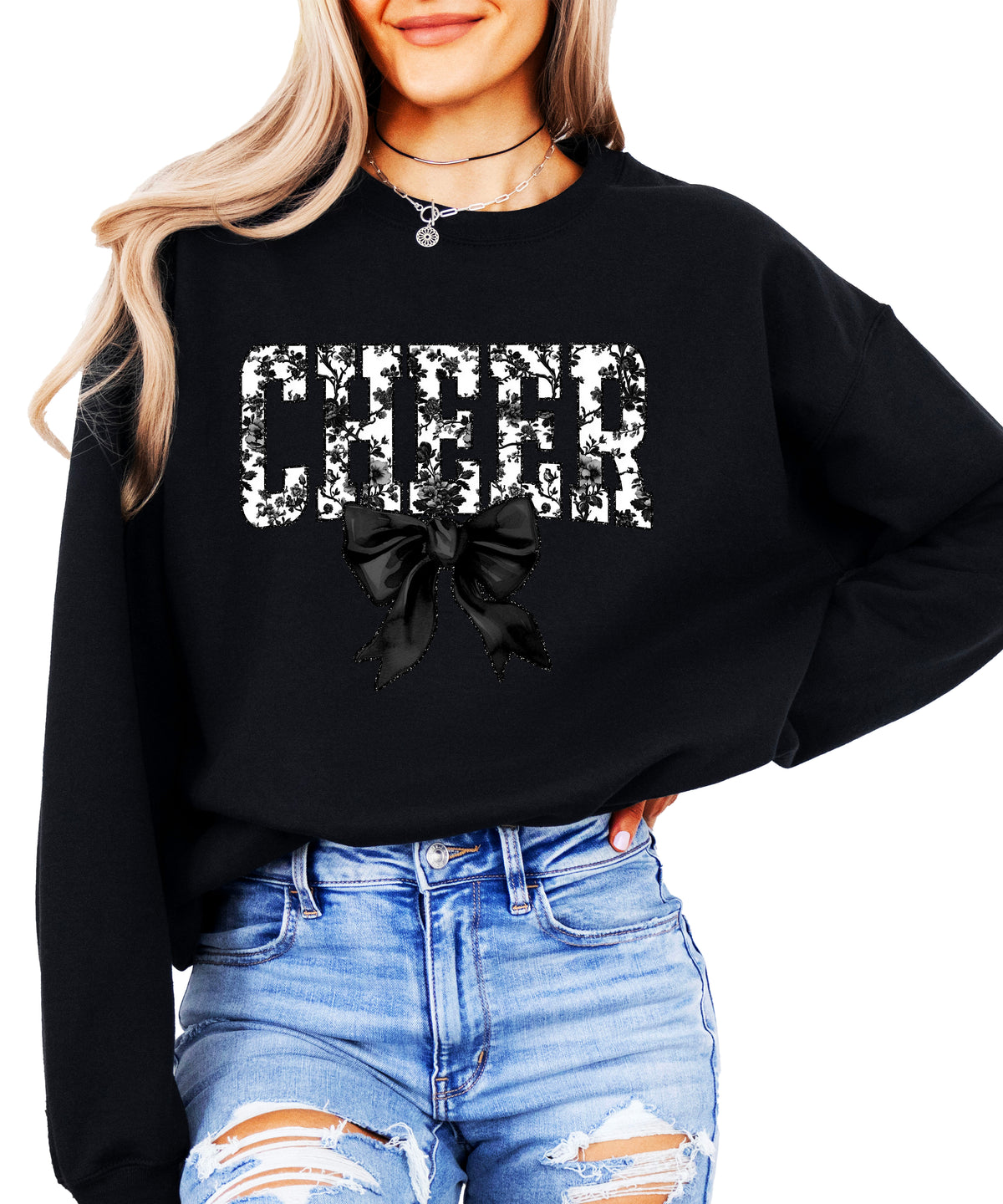 Black cheer sweatshirt with black floral bow design, detail view