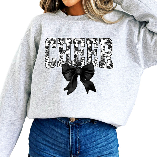 Gray cheer sweatshirt with black floral bow design, detail view