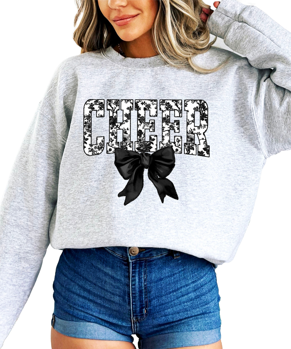 Gray cheer sweatshirt with black floral bow design, detail view