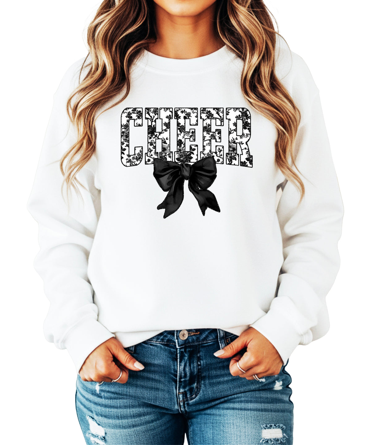 White crewneck sweatshirt with black floral CHEER varsity letters and coquette bow, front view