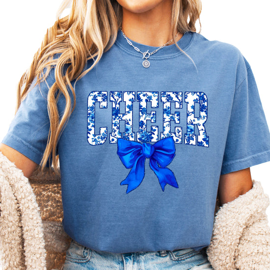 Cheer blue floral coquette bow Comfort Colors tee for women in Blue Jean, front view