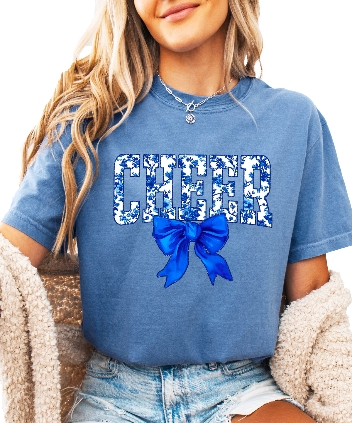 Cheer blue floral coquette bow Comfort Colors tee for women in Blue Jean, front view