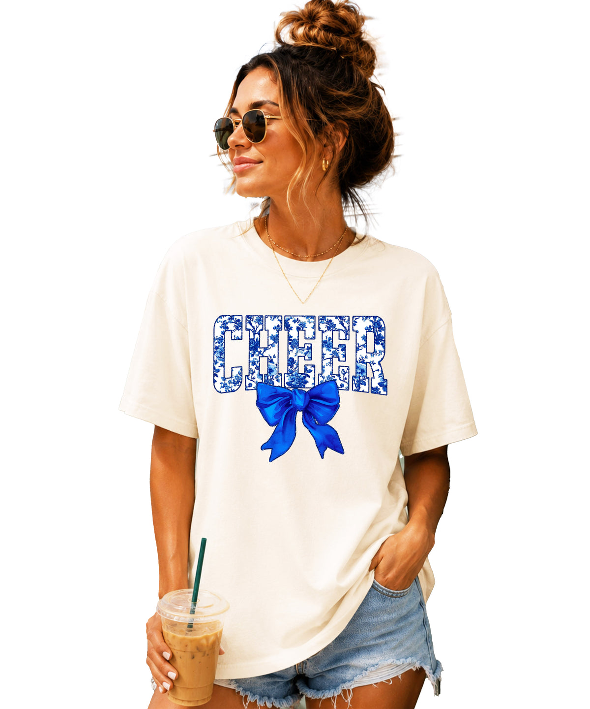 Cheer blue floral coquette bow Comfort Colors tee for women in Ivory, front view