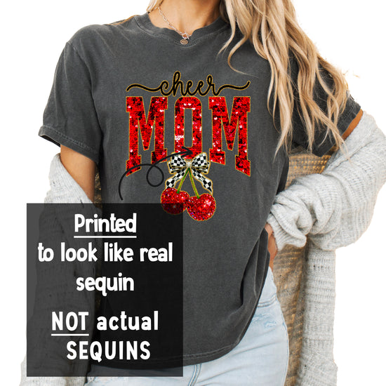 Cheerleader mom cherry coquette bow shirt, close-up of the ink-printed faux sequin design