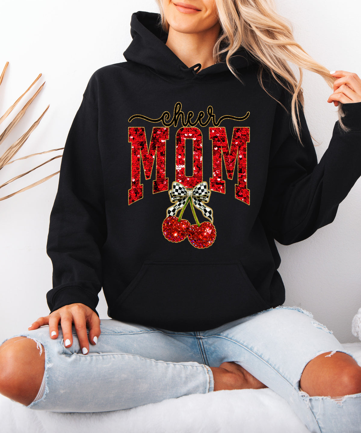 Black cheerleader mom hoodie for women with ink-printed cheer script, faux sequin MOM and cherry bow graphic - view 5