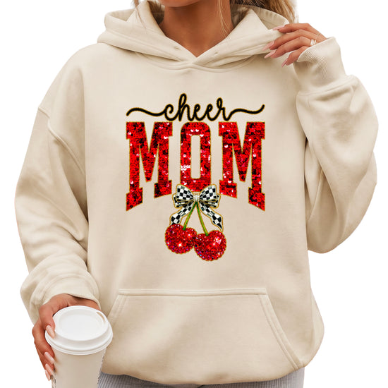 Sand cheerleader mom hoodie for women with ink-printed cheer script, faux sequin MOM and cherry bow graphic - front view