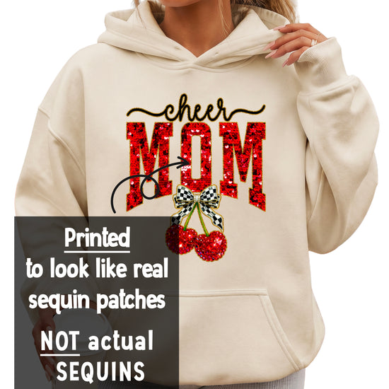 Cheerleader mom hoodie close-up of the ink-printed cheer script, faux sequin MOM letters and checkered bow cherries