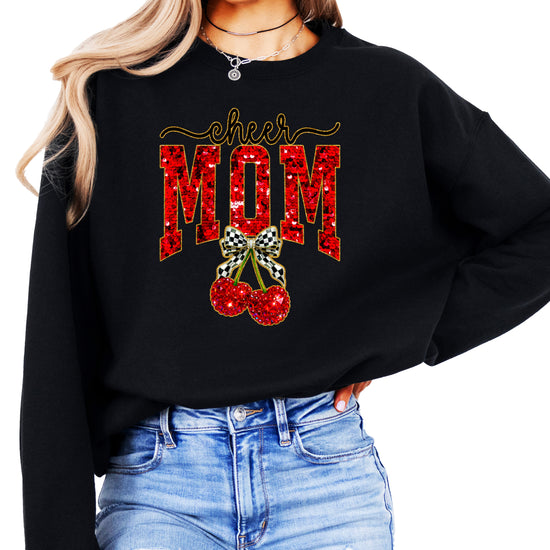 Black Cheerleader Mom crewneck sweatshirt with ink-printed faux sequin cheer script, MOM lettering and cherry coquette bow, front view