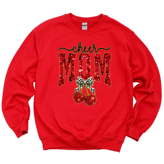 Red Cheerleader Mom crewneck sweatshirt with ink-printed faux sequin cheer script, MOM lettering and cherry coquette bow, flat lay view
