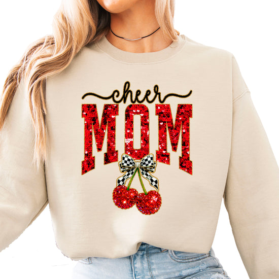 Sand Cheerleader Mom crewneck sweatshirt with ink-printed faux sequin cheer script, MOM lettering and cherry coquette bow, front view