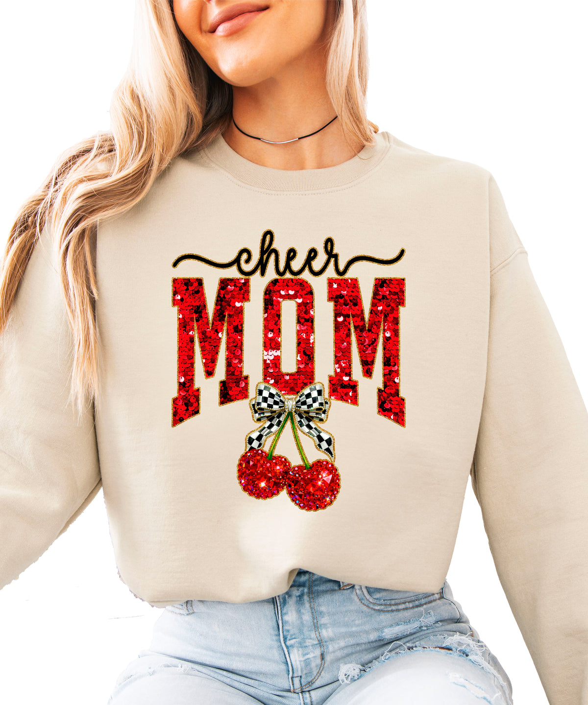Sand Cheerleader Mom crewneck sweatshirt with ink-printed faux sequin cheer script, MOM lettering and cherry coquette bow, front view