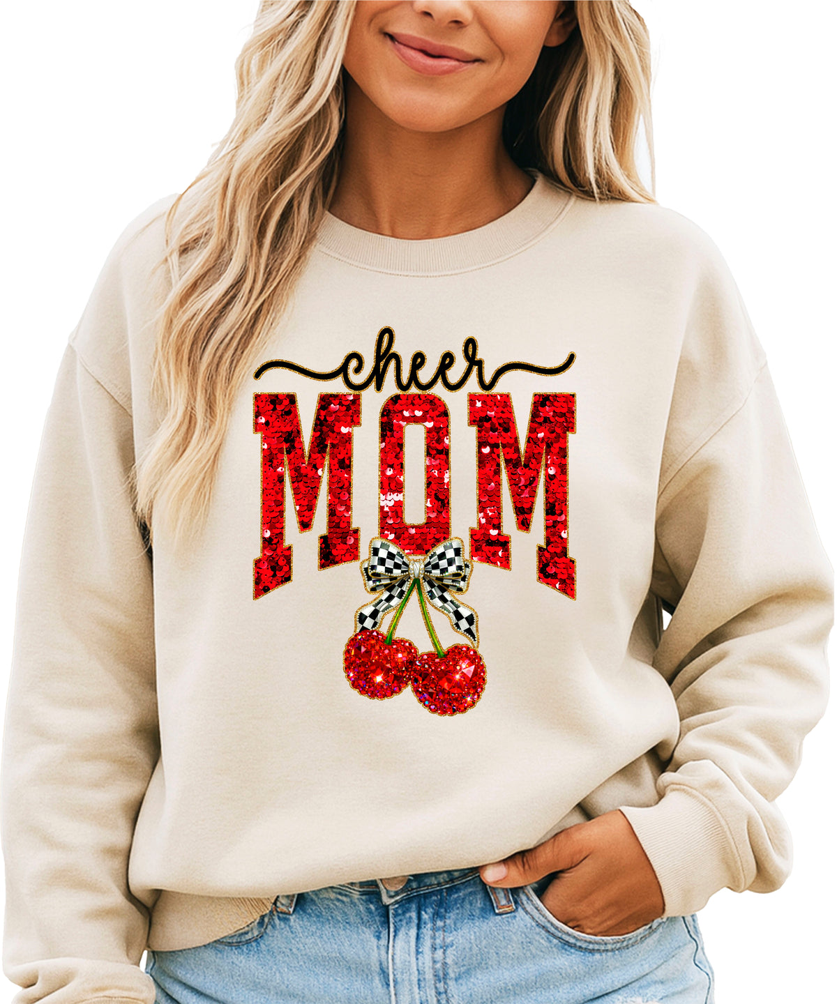 Sand Cheerleader Mom crewneck sweatshirt with ink-printed faux sequin cheer script, MOM lettering and cherry coquette bow, close-up of the ink-printed design
