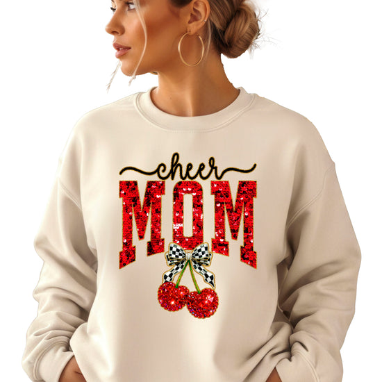 Sand Cheerleader Mom crewneck sweatshirt with ink-printed faux sequin cheer script, MOM lettering and cherry coquette bow, styled detail view