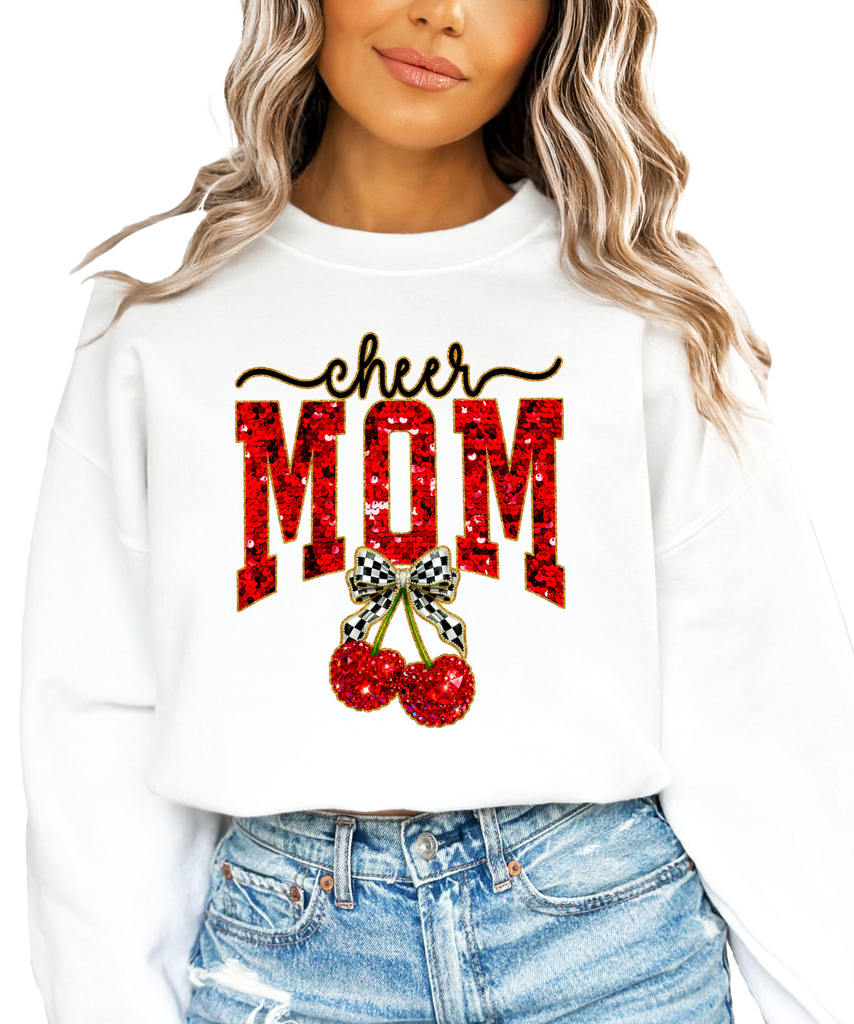 White Cheerleader Mom crewneck sweatshirt with ink-printed faux sequin cheer script, MOM lettering and cherry coquette bow, close-up of the ink-printed design