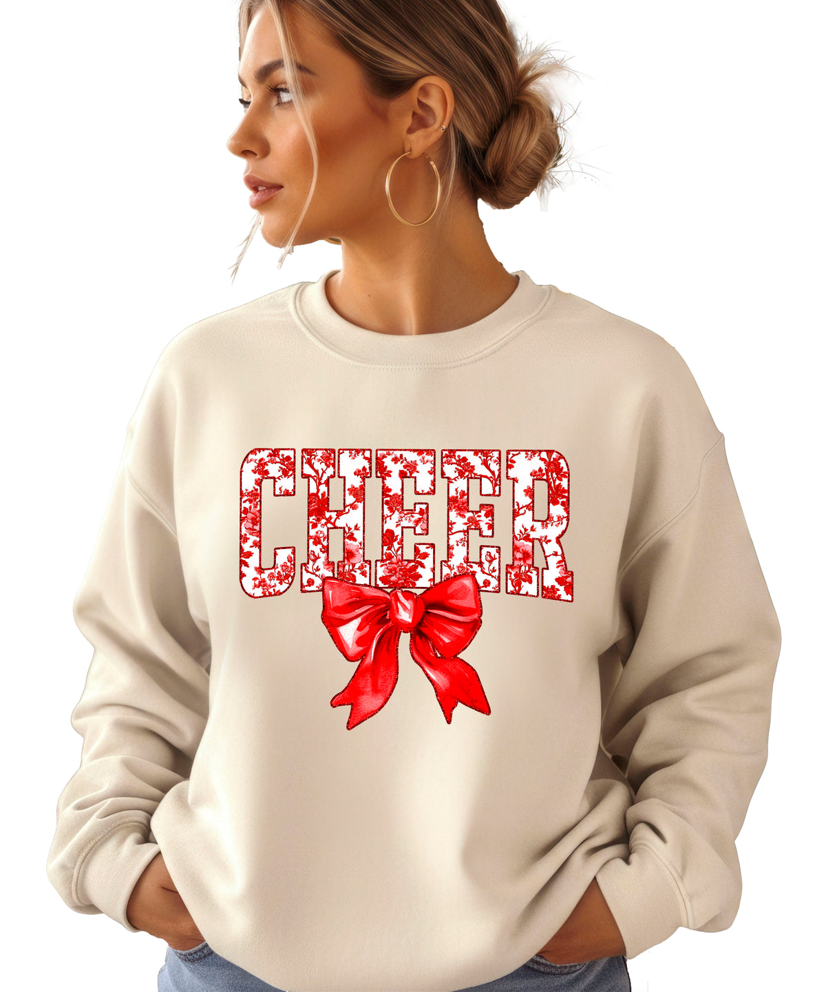 Sand crewneck sweatshirt with red floral CHEER lettering and red coquette bow, view 1