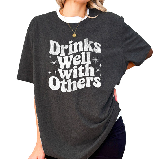 Drinks Well With Others funny graphic tee for women in Dark Gray Heather, back view