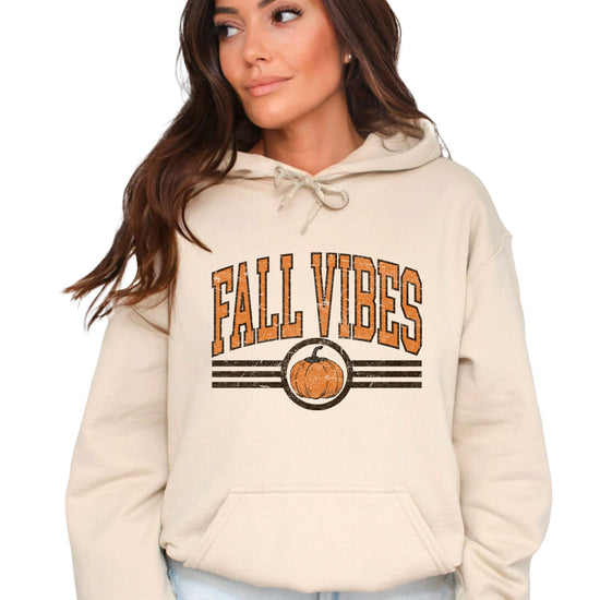 Fall Vibes vintage varsity pumpkin hoodie for women in Sand, front view