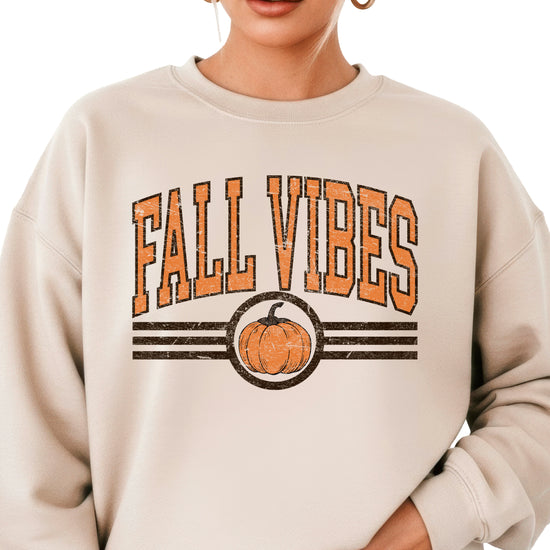 Fall Vibes retro pumpkin graphic crewneck sweatshirt in Sand, detail of the graphic