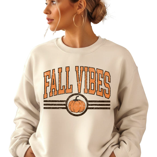 Fall Vibes retro pumpkin graphic crewneck sweatshirt in Sand, model wearing