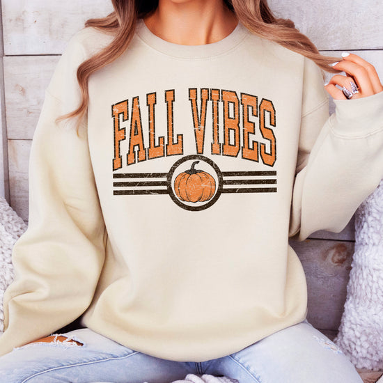 Fall Vibes retro pumpkin graphic crewneck sweatshirt in Sand, styled outfit