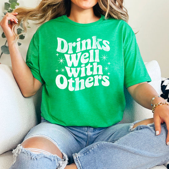 Drinks Well With Others funny graphic tee for women in Vintage Green, back view