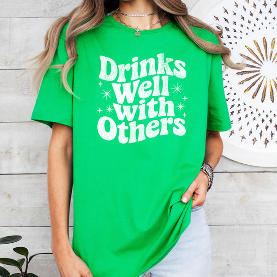 Drinks Well With Others funny graphic tee for women in Vintage Green, detail view