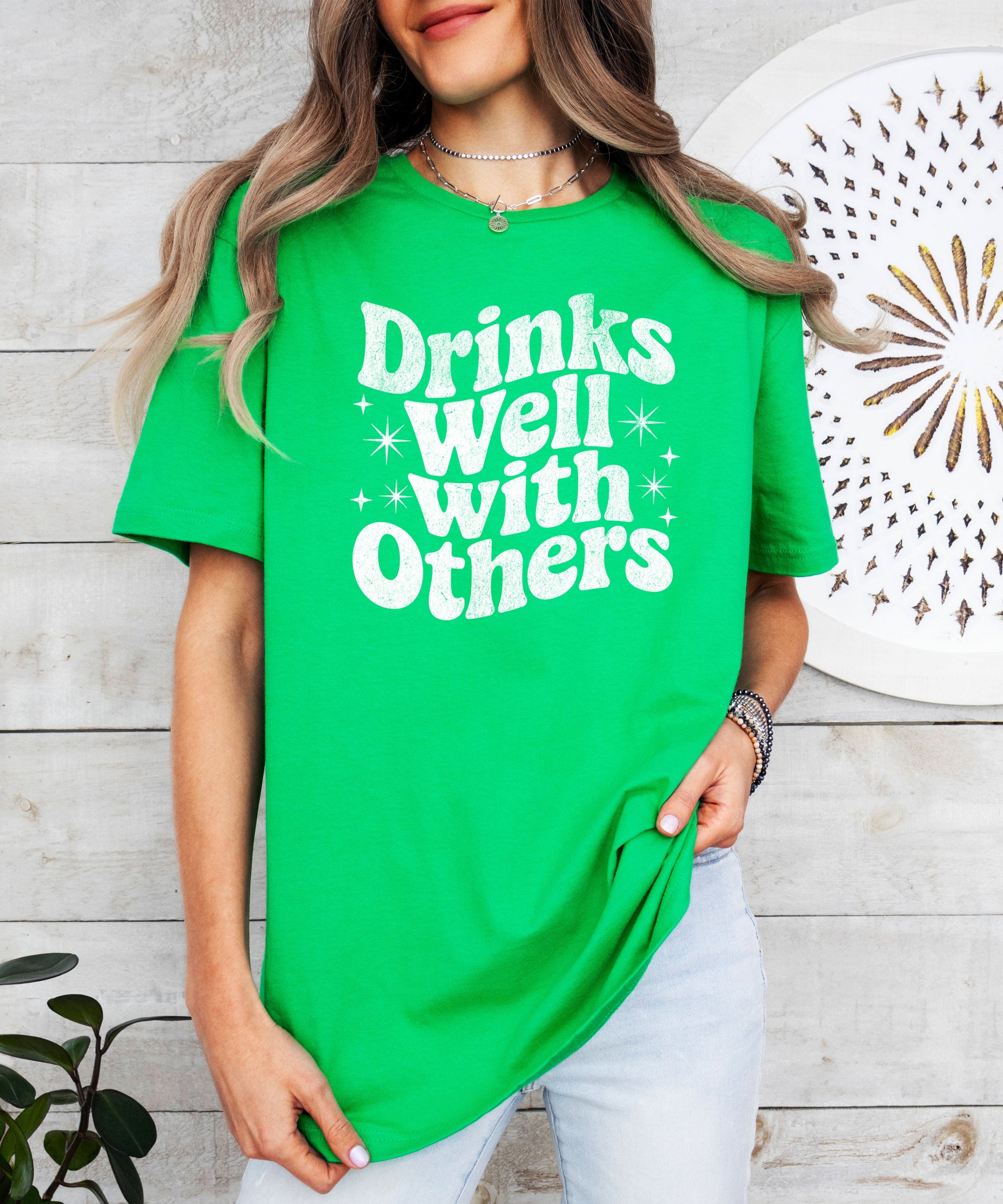 Drinks Well With Others funny graphic tee for women in Vintage Green, detail view