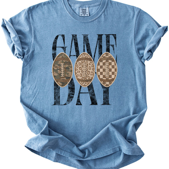 Game Day football shirt for women in Blue Jean, detail view of the ink-printed football patch graphic, Comfort Colors 1717 garment-dyed heavyweight cotton tee by Olive Loves Apple