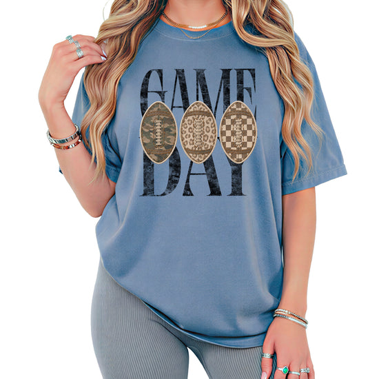 Game Day football shirt for women in Blue Jean, styled flat lay, Comfort Colors 1717 garment-dyed heavyweight cotton tee by Olive Loves Apple