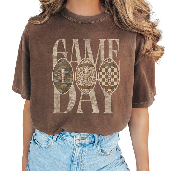 Game Day football shirt for women in Espresso, styled flat lay, Comfort Colors 1717 garment-dyed heavyweight cotton tee by Olive Loves Apple