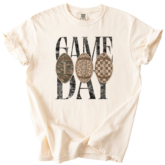Game Day football shirt for women in Ivory, detail view of the ink-printed football patch graphic, Comfort Colors 1717 garment-dyed heavyweight cotton tee by Olive Loves Apple
