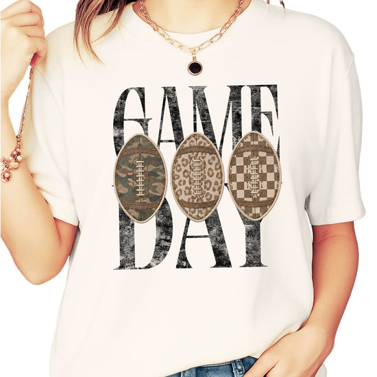 Game Day football shirt for women in Ivory, styled flat lay, Comfort Colors 1717 garment-dyed heavyweight cotton tee by Olive Loves Apple