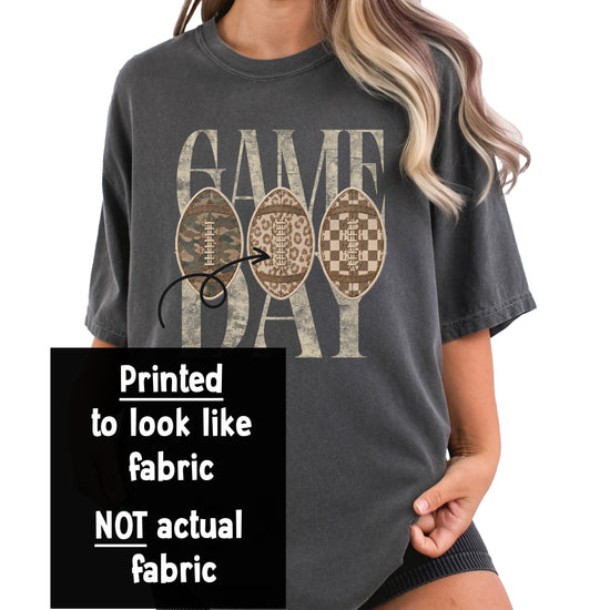 Game Day football graphic tee design close-up, distressed GAME DAY lettering with camo, leopard and checkered ink-printed football patches