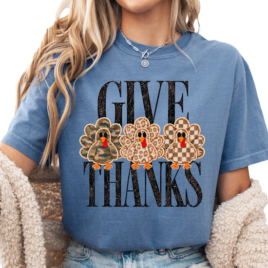 Faux patch turkey Thanksgiving tee in blue jean, camo leopard and checkered turkeys, Comfort Colors, front view