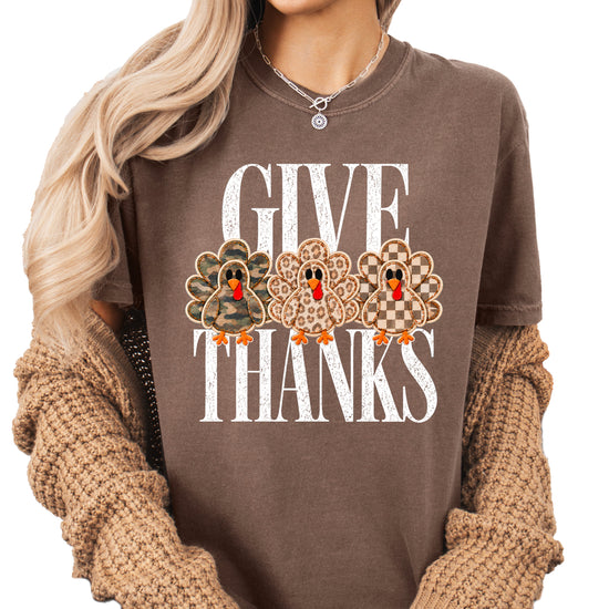 Faux patch turkey Thanksgiving tee in espresso, camo leopard and checkered turkeys, Comfort Colors, front view