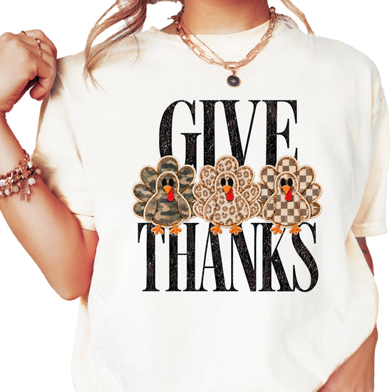 Faux patch turkey Thanksgiving tee in ivory, camo leopard and checkered turkeys, Comfort Colors, front view