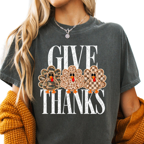 Faux patch turkey Thanksgiving tee in pepper, camo leopard and checkered turkeys, Comfort Colors, front view