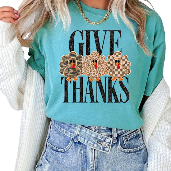 Faux patch turkey Thanksgiving tee in seafoam, camo leopard and checkered turkeys, Comfort Colors, front view