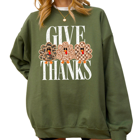 Give Thanks Thanksgiving sweatshirt for women in Army Green with camo, leopard and checkered turkeys