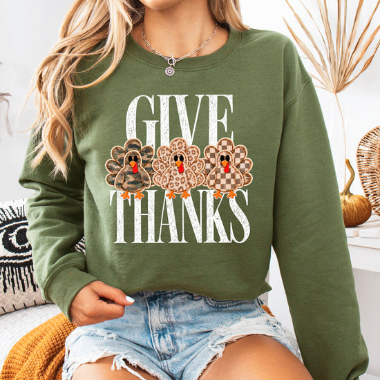 Give Thanks Thanksgiving sweatshirt for women in Army Green with camo, leopard and checkered turkeys